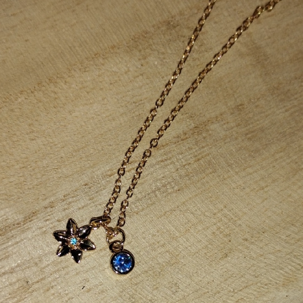Gold Tone Flower Pendant Necklace with Light Blue Birthstone